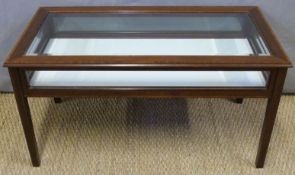 A crossbanded mahogany glazed silver/bijouterie table with bevelled glass top panel,