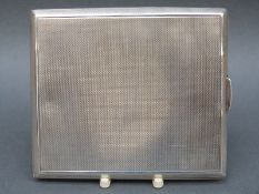 An Art Deco hallmarked silver engine turned cigarette case,