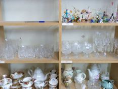 A collection of cut glass drinking glasses including eight whisky, six highball, six brandy, wine,