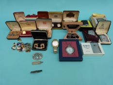 A collection of cufflinks, five Ronson lighters, silver ingot,