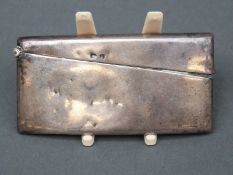A George V hallmarked silver curved card case, Birmingham 1910 maker's mark rubbed, length 8.