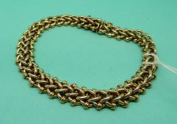 A 15ct gold bracelet in a plaited design, 18.4g.