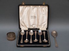 A cased set of six hallmarked silver teaspoons, further silver teaspoon and a napkin ring,