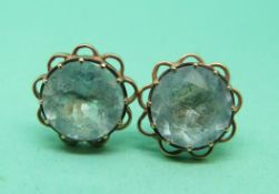 A pair of yellow metal earrings marked 14k set with topaz