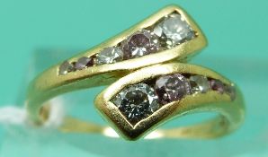 An 18ct gold ring set with two sets of graduating pink and colourless round brilliant cut diamonds
