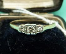 An 18ct gold ring set with diamonds in a platinum setting,