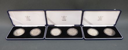 Three cased pairs of silver Britannia £5 crowns