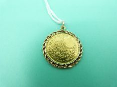 A Turkish 100 Kursh gold coin in yellow metal mount marked 14K, overall weight 9.