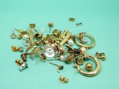 Eight pairs of 9ct gold earrings to include two pairs of hoop earrings, one pair set with opals,