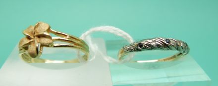A yellow metal ring marked 14k in the shape of a flower and a 9ct gold ring set with diamonds and
