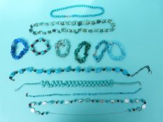 Five turquoise necklaces including one with alternating pearls,