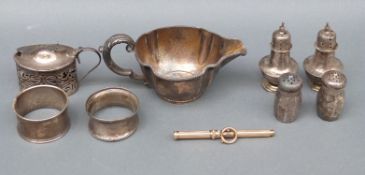 A Gorham white metal jug marked sterling, two hallmarked silver napkin rings,