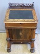A 19thC rosewood inlaid Davenport desk, the lift up writing surface revealing satinwood interior,
