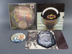 An American Sgt Pepper - The Beatles picture disc, The Police - Roxanne badge shaped picture disc,