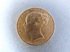 An 1864 shield back bun head Victoria gold full sovereign,
