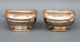 A pair of William IV hallmarked silver pedestal salts, London 1819 maker J F Terrey & Co,