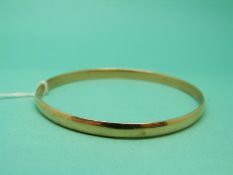 A plain 18ct gold bangle, 14.8g.