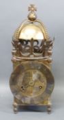 A brass lantern clock dated 1937 George VI coronation with Roman dial and single pointer hand,