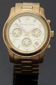 Michael Kors gold plated ladies chronograph wristwatch with date aperture and luminous hands and