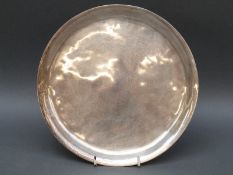 A modern hallmarked silver tray of hammered design, London 1977 maker Irena Rushton, diameter 20cm,