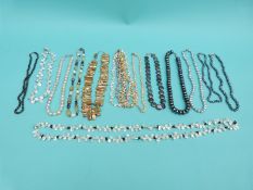 Thirteen pearl necklaces including freshwater and cultured,