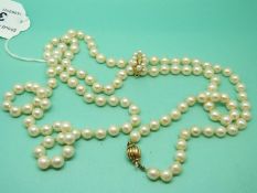 A single strand of cultured pearls made up of 121 pearls with 18ct gold clasp and a runner set with