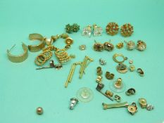 Eight pairs of 9ct gold earrings including a pair set with emeralds, one set with smoky quartz,