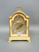 Elliott of London chinoiserie mantel clock in gold coloured lacquer with oriental figures to sides,