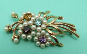A yellow metal brooch set with pearls, garnet, citrine,