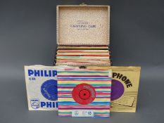 A Winnel carrying case full of EPs and singles from the 1950's and 60's