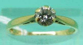An 18ct gold ring set with diamond solitaire of approximately 0.
