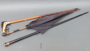 Collection of walking sticks/parasols including a hallmarked silver topped example