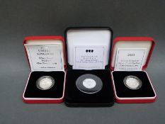 A 1999 silver proof Piedfort £1 coin together with a 2001 example, both cased with certificates,