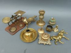 A collection of brassware including postal scales,