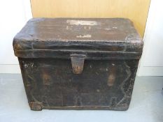 A vintage leather luggage trunk with GWR label,