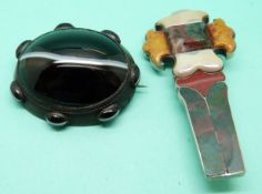A Victorian banded agate brooch and a silver Victorian cross brooch set with agate sections.