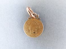 An 1856 gold one dollar coin
