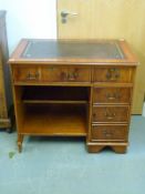 A leather inset desk,