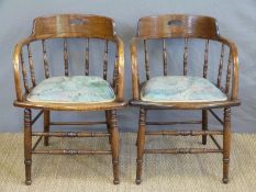 A pair of Windsor oak elbow chairs