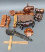 A box of carvings to include a logging elephant, bear,