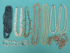 Nine pearl necklaces including freshwater pearls in different colours including some extremely long
