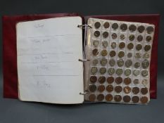 An amateur collection of UK and world coins in a collector's album to include some silver content
