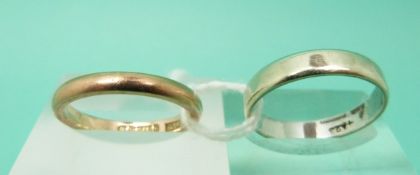 A 9ct white gold wedding ring and a 9ct gold example,