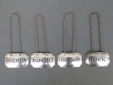 A set of four Georgian hallmarked silver bottle labels or tickets, with pierced names Sherry,