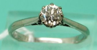 A white metal ring set with an old cut diamond of approx 0.