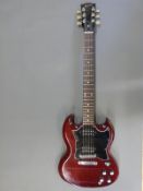 Gibson SG Special solid body electric guitar in cherry gloss finish with black finger plates,