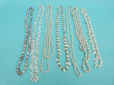 Ten pearl necklaces including a multi colour three strand necklace,