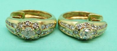 A pair of 18ct gold earrings,