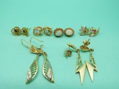 Two pairs of yellow metal earrings set with opals, a pair of 9ct gold earrings set with opals,