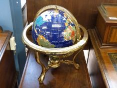 A pietra dura globe on brass stand with compass,